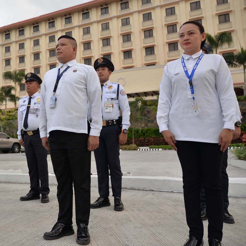 Two security guards in the back and a security officer and female security officer in front