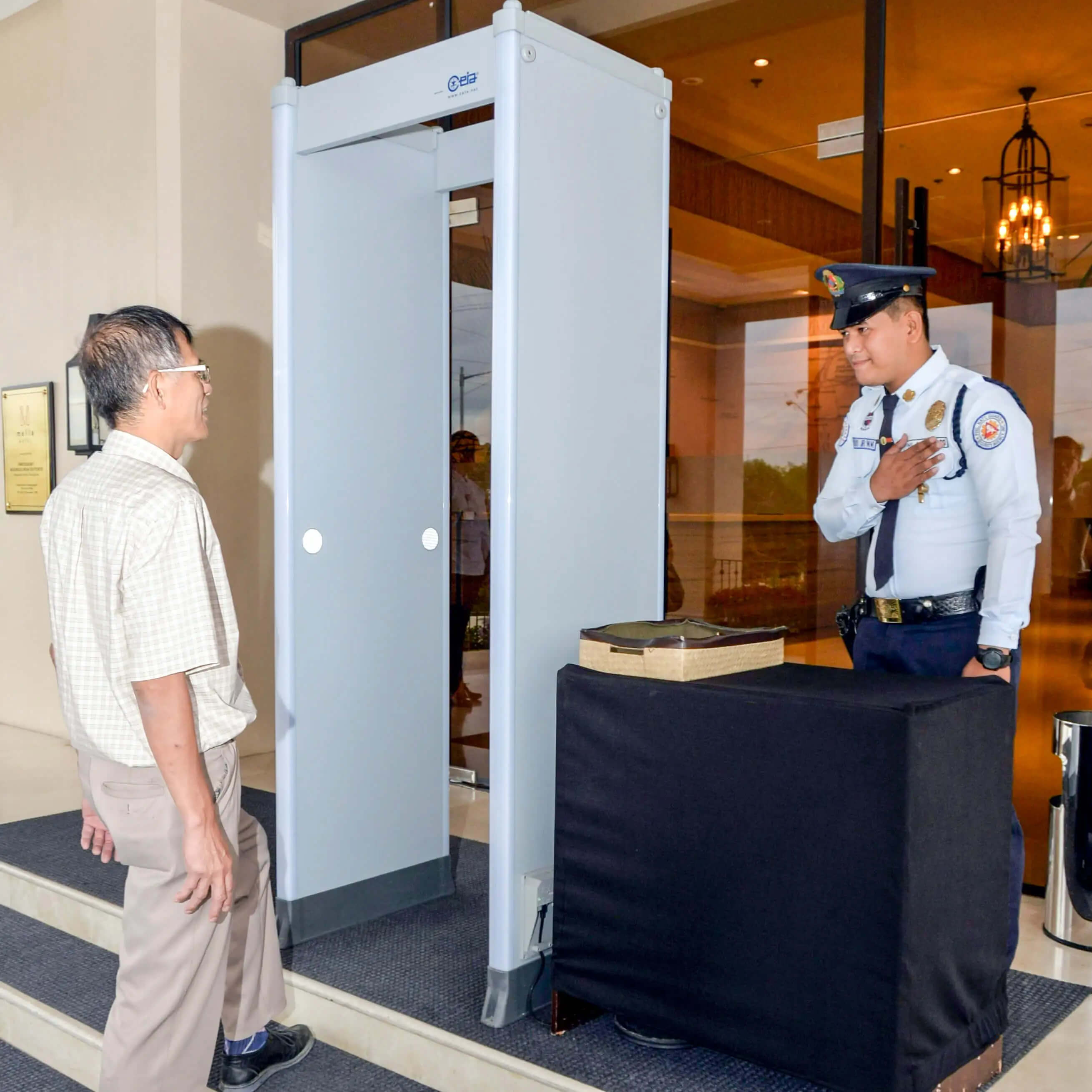 A security guard greeting a guest
